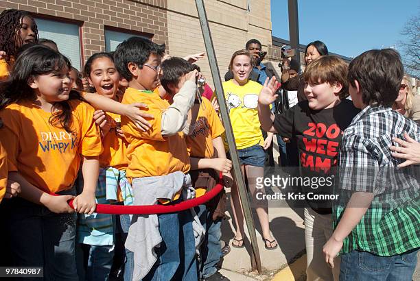 Robert Capron and Zachary Gordon greet students during the premiere of "Diary Of A Wimpy Kid" at on March 18, 2010 in Alexandria, Virginia.