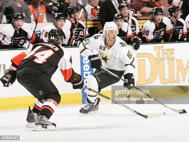 Mike Ribeiro of the Dallas Stars handles the puck against Kimmo Timonen of the Philadelphia Flyers on March 18, 2010 at the American Airlines Center...