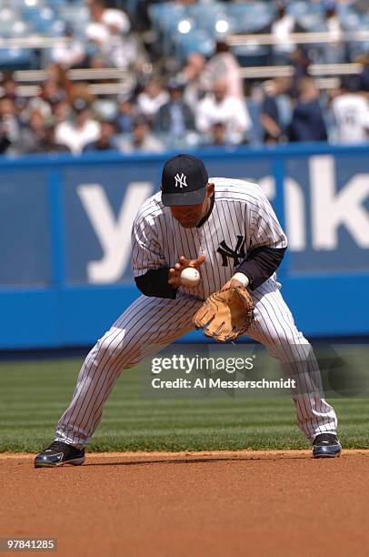 New York Yankees second baseman Miguel Cairo fields a ball against the Kansas City Royals April 12, 2006 in New York. The Yankees defeated the Kansas...