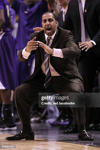 Head coach Lorenzo Romar of the Washington Huskies reacts to a play against the Marquette Golden Eagles during the first round of the 2010 NCAA men's...