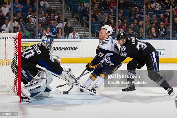 Mike Lundin of the Tampa Bay Lightning prevents Raffi Torres of the Buffalo Sabres from scoring against goaltender Antero Niittymaki during the...