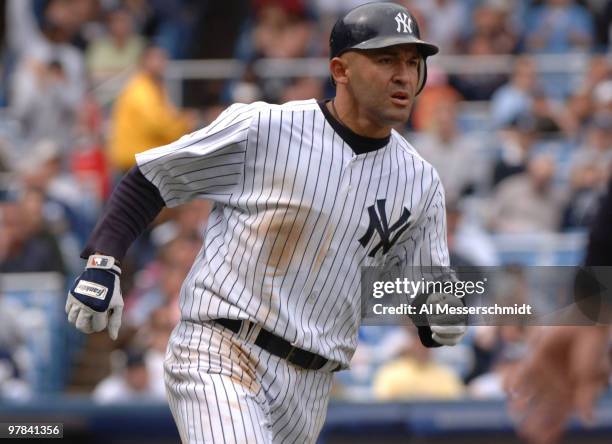 New York Yankees second baseman Miguel Cairo hustles to first base against the Kansas City Royals at Yankee Stadium in Bronx, New York on April 12,...