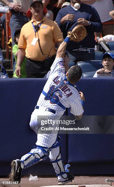 New York Mets cather Paul La Duca grabs a foul ball against the Milwaukee Brewers April 16, 2006 in New York.