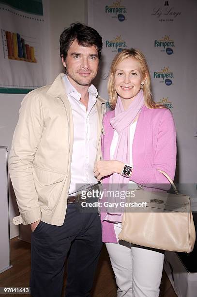 Actors Matthew Settle and Kelly Rutherford attend the Pampers Dry Max launch party at Helen Mills Theater on March 18, 2010 in New York City.