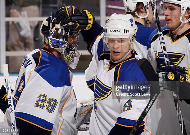 Paul Kariya of the St. Louis Blues congratulates teammate Ty Conklin on the win against the New York Rangers on March 18, 2010 at Madison Square...