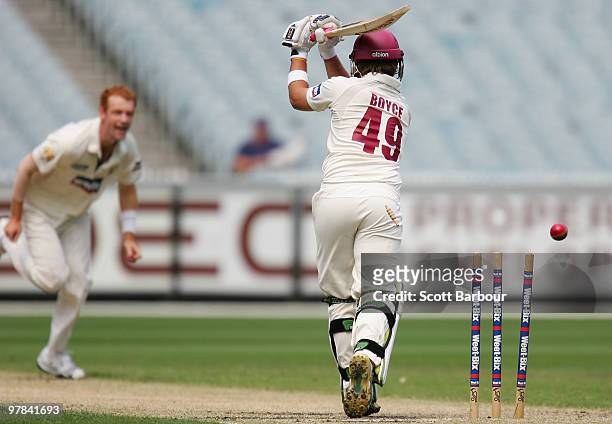 Cameron Boyce of the Bulls is bowled out by Andrew McDonald of the Bushrangers during day three of the Sheffield Shield Final between the Victorian...