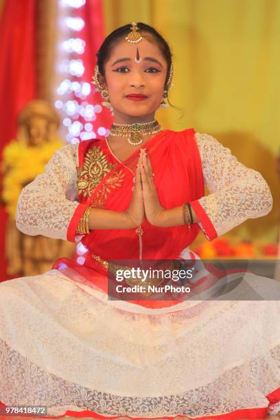 Tamil Bharatnatyam dancer performs a fusion dance mixing traditional styles with modern elements during a cultural program celebrating Tamil Heritage...