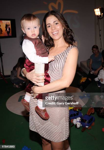Actress Ana Ortiz, holding daughter Paloma, attends the Pampers Dry Max launch party at Helen Mills Theater on March 18, 2010 in New York City.