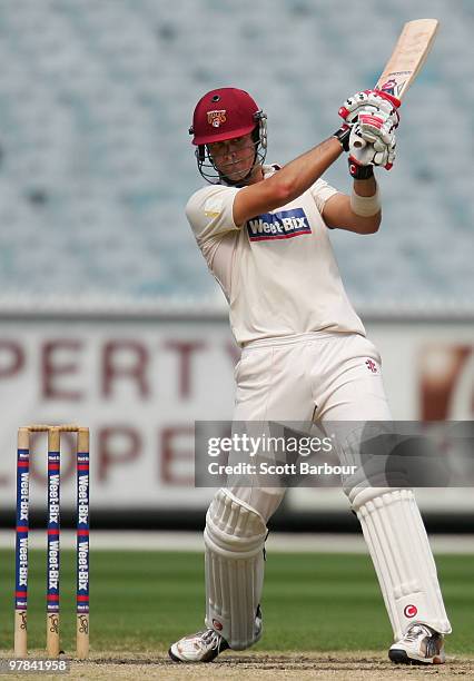 Ben Cutting of the Bulls hits a shot during day three of the Sheffield Shield Final between the Victorian Bushrangers and the Queensland Bulls at the...