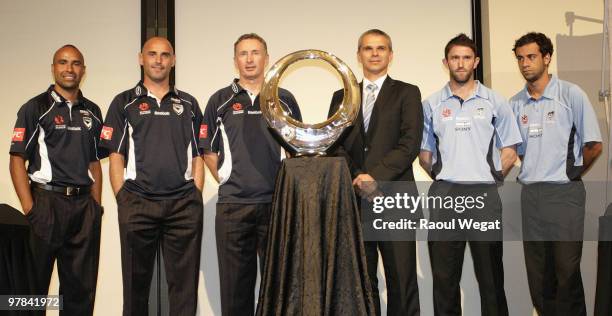 Melbourne Victory players Archie Thompson, captain Kevin Muscat, and coach Ernie Merrick, Sydney FC coach Vitezslav Lavicka, Terry McFlynn, and Alex...