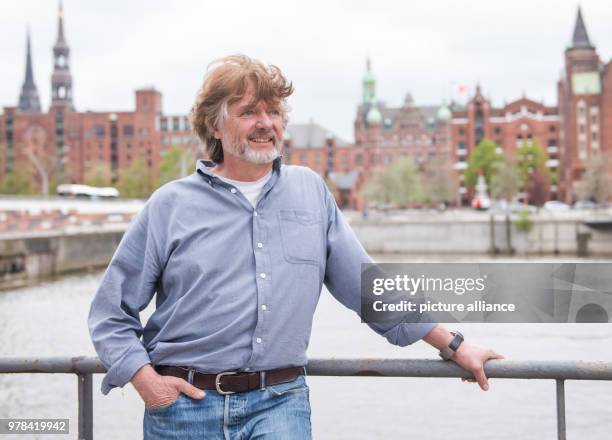 April 2018, Germany, Hamburg: Polar researcher Arved FUchs standing in front of the Speicherstadt. Fuchs turns 65 on 26 April 2018. Photo: Daniel...