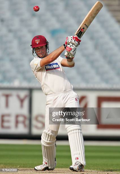 Ben Cutting of the Bulls hits a shot during day three of the Sheffield Shield Final between the Victorian Bushrangers and the Queensland Bulls at the...