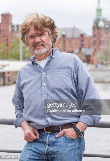 April 2018, Germany, Hamburg: Polar researcher Arved FUchs standing in front of the Speicherstadt. Fuchs turns 65 on 26 April 2018. Photo: Daniel...