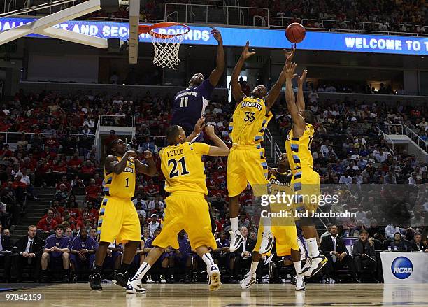 Forward Jimmy Butler of the Marquette Golden Eagles looks to rebound the ball against the Washington Huskies during the first round of the 2010 NCAA...