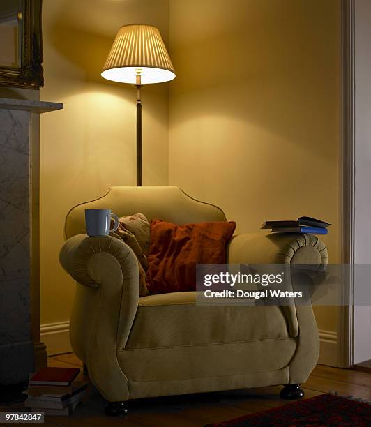 arm chair in living room - electric lamp stock pictures, royalty-free photos & images