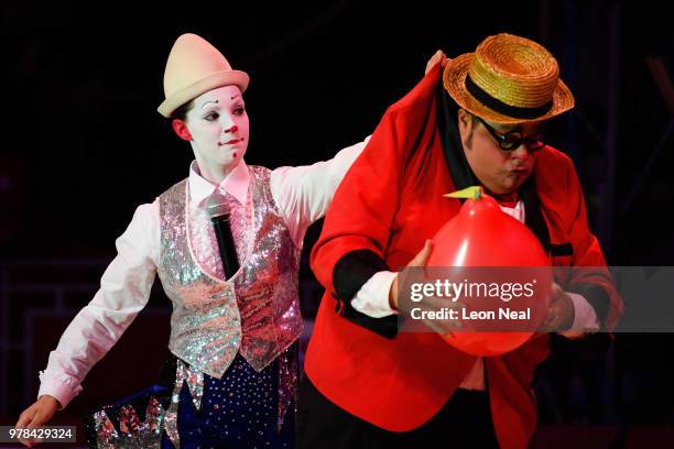 Clown Totti Alexis of Spain is grasped by his wife Charlotte Alexis of Belgium during a performance at Zippo's circus in Victoria Park on June 14,...