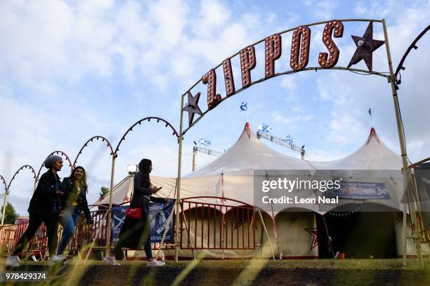 Three audience members head into the big top, ahead of a matinee performance at Zippo's circus in Victoria Park on June 14, 2018 in Glasgow,...