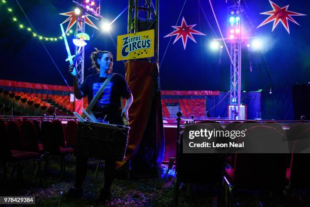 Rosie Ireland of England sells glowing light sticks, ahead of a performance at Zippo's circus in Victoria Park on June 13, 2018 in Glasgow, Scotland....