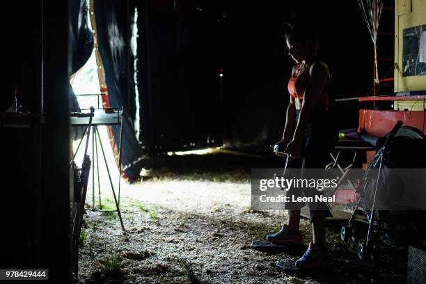 Acrobat Jany Gonzalez Herrera of Cuba trains with weights backstage at Zippo's circus in Victoria Park on June 15, 2018 in Glasgow, Scotland. As the...