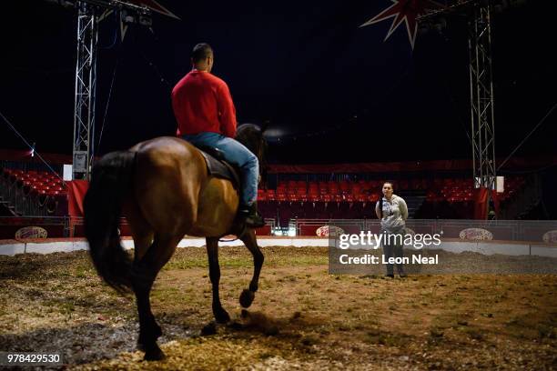 Horse rider Helena Khadikova of Poland talks with her husband Tamerlan Khadikov of Kazakhstan, ahead of a matinee performance at Zippo's circus in...