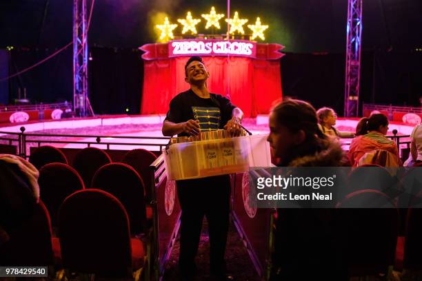 Victor Antunez of Argentina sells popcorn, ahead of a performance at Zippo's circus in Victoria Park on June 13, 2018 in Glasgow, Scotland. As the...