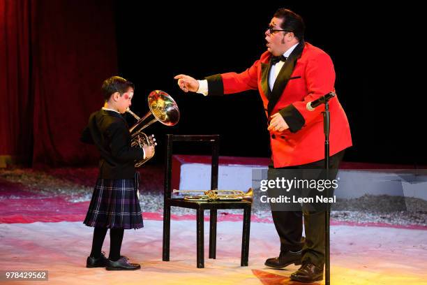 Clown Totti Alexis of Spain reacts as his son Charlie joins his act during a performance at Zippo's circus in Victoria Park on June 14, 2018 in...