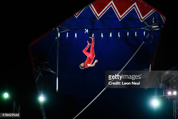Trapeze artist Alex Michael of Brazil takes part in a performance at Zippo's circus in Victoria Park on June 13, 2018 in Glasgow, Scotland. As the...
