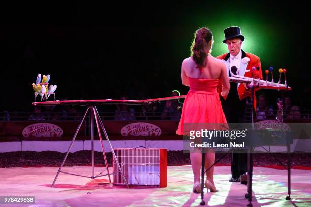 Ringmaster Norman Barrett of England and Melissa Jimenez Perez of Cuba take part in a performance at Zippo's circus in Victoria Park on June 13, 2018...