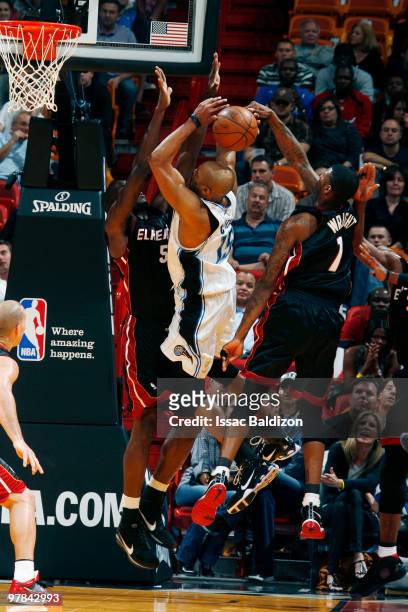 Vince Carter of the Orlando Magic shoots against Joel Anthony of the Miami Heat on March 18, 2010 at American Airlines Arena in Miami, Florida. NOTE...