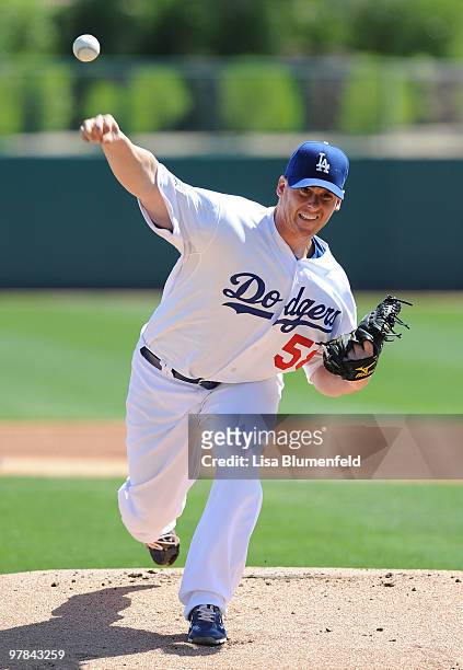 Chad Billingsley of the Los Angeles Dodgers pitches during a spring training game against the Chicago Cubs on March 18, 2010 at The Ballpark at...