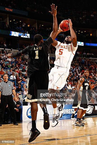 Damion James of the Texas Longhorns shoots the ball over Al-Farouq Aminu of the Wake Forest Demon Deacons during the first round of the 2010 NCAA...