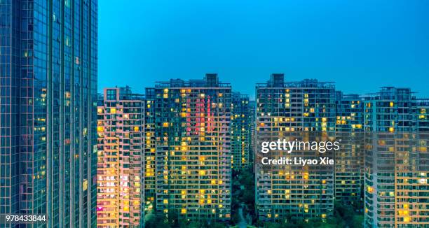 illuminated residential building - xie liyao stock pictures, royalty-free photos & images