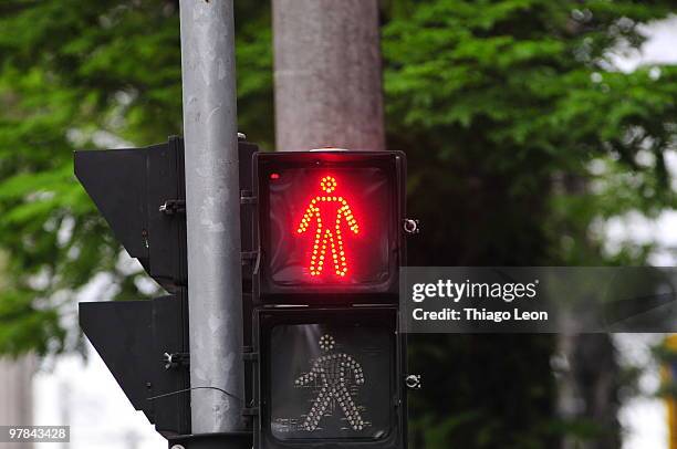 stop signal displayed on traffic light - walk signal stock pictures, royalty-free photos & images