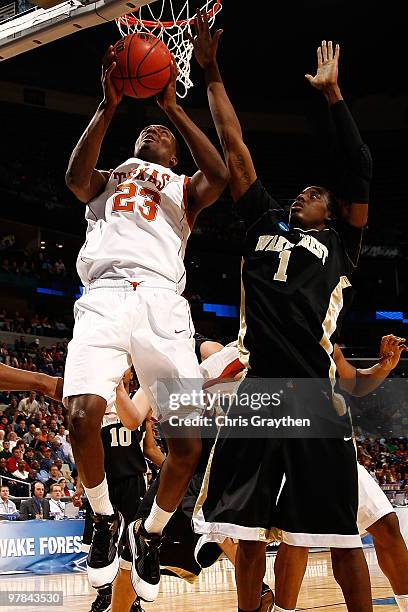 Jordan Hamilton of the Texas Longhorns shoots the ball over Al-Farouq Aminu of the Wake Forest Demon Deacons during the first round of the 2010 NCAA...