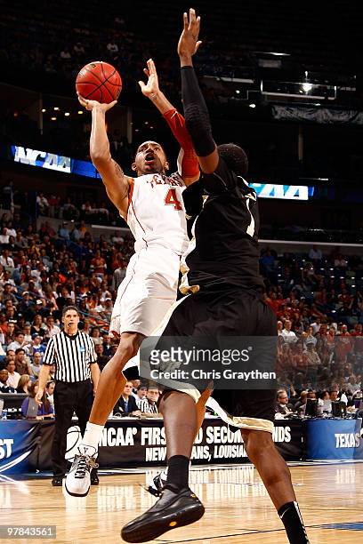 Gary Johnson of the Texas Longhorns shoots the ball over Al-Farouq Aminu of the Wake Forest Demon Deacons during the first round of the 2010 NCAA...