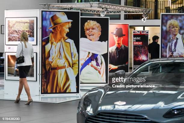 April 2018, Germany, Berlin: A pop-up exhibition 'David & I' from artist Denis O'Regan has 50 photos of David Bowie opened at the car exhibition from...