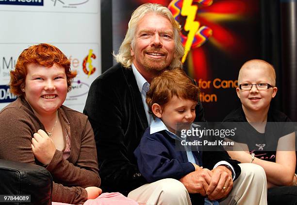 Sir Richard Branson poses with children who are being treated with cancer prior to a breakfast function, as part of a series of fundraising events...