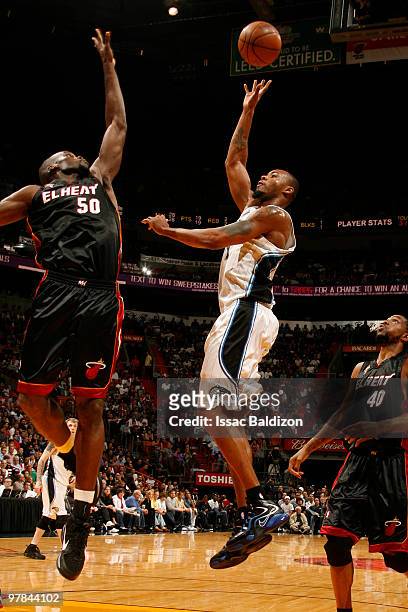 Rashard Lewis of the Orlando Magic shoots against Joel Anthony of the Miami Heat on March 18, 2010 at American Airlines Arena in Miami, Florida. NOTE...