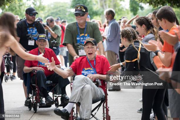 Washington, D.C. World War II Navy veteran Don Starkey and Vietnam Army veteran and guardian Larry Dunn, both of Nevada, are greeted warmly during an...