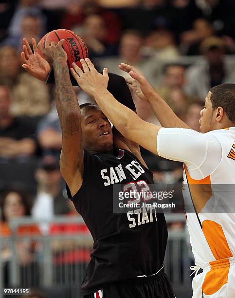 Billy White of the San Diego State Axtecs feels the pressure of the Tennessee Volunteers during the first round of the 2010 NCAA men's basketball...