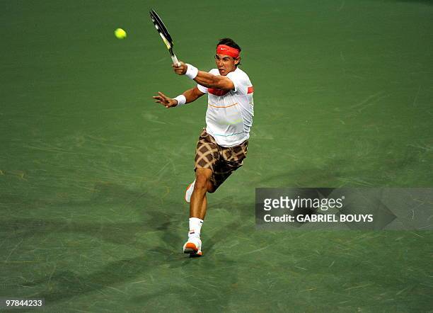 Rafael Nadal of Spain returns a shot to Tomas Zimonjic of Czech Republic during the BNP Paribas Open on March 18, 2010 at the Indian Wells Tennis...