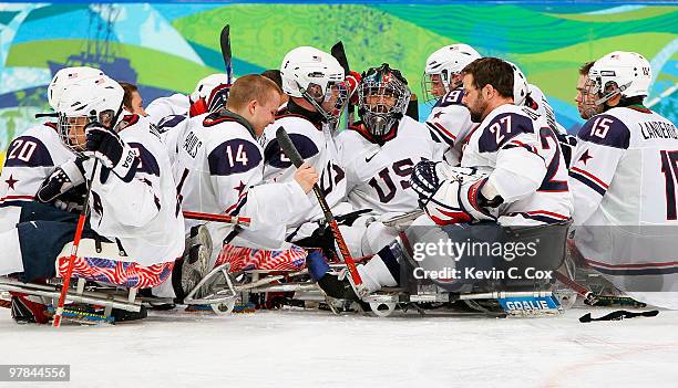 The United States Team celebrate their 3-0 victory over Norway during the Ice Sledge Hockey Play-off Seminfinal Game on day seven of the 2010...