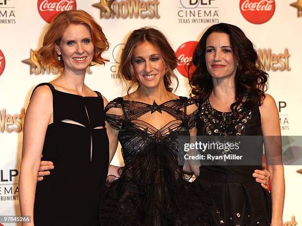 Actresses Cynthia Nixon, Sarah Jessica Parker and Kristin Davis, recipients of the Ensemble Award, arrive at the ShoWest awards ceremony at the Paris...