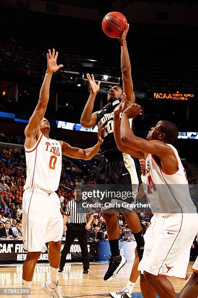 Ishmael Smith of the Wake Forest Demon Deacons shoots the ball over Avery Bradley of the Texas Longhorns during the first round of the 2010 NCAA...