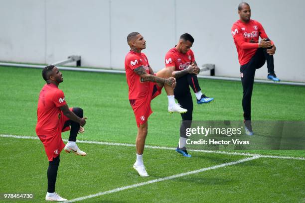 Jefferson Farfan, Paolo Guerrero, Miguel Trauco and Alberto Rodriguez of Peru warm up during a training session at Arena Khimki on June 19, 2018 in...