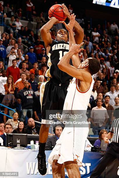 Ishmael Smith of the Wake Forest Demon Deacons shoots the ball over Avery Bradley of the Texas Longhorns in the last second to win the game in...