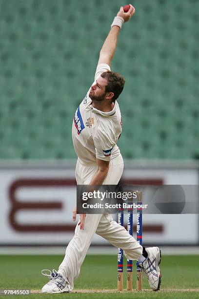 Chris Swan of the Bulls bowls during day three of the Sheffield Shield Final between the Victorian Bushrangers and the Queensland Bulls at the...