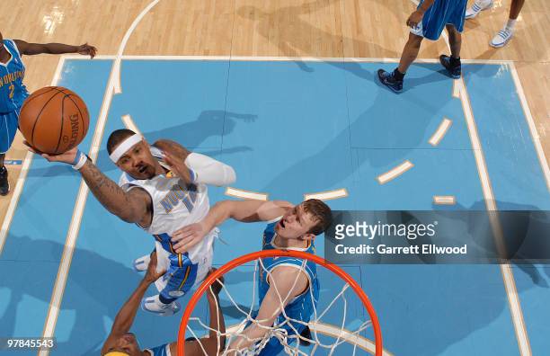 Carmelo Anthony of the Denver Nuggets goes to the basket against the New Orleans Hornets on March 18, 2010 at the Pepsi Center in Denver, Colorado....