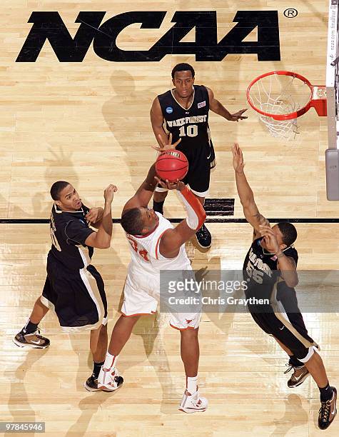 Dexter Pittman of the Texas Longhorns shoots the ball over Tony Woods of the Wake Forest Demon Deacons during the first round of the 2010 NCAA men�s...