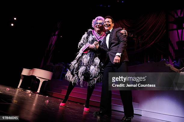 Actors Dame Edna and Michael Feinstein take a bow during curtain call on the opening night of "All About Me" on Broadway at Henry Miller's Theatre on...